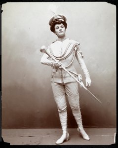 Una mujer modelando un uniforme de banda, sosteniendo una batuta, c.1898